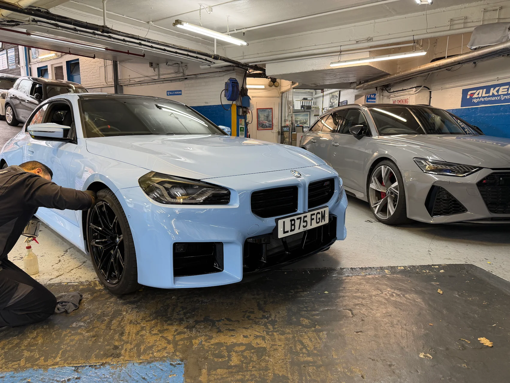 Technician working on a BMW M2 in the One Way Motors workshop